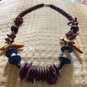 This beautiful parrot hand carved wood necklace is a for sure statement piece.